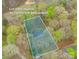 Aerial view showing approximate lot lines of a property surrounded by lush greenery and trees at 113 Hidden Ln, Mooresville, NC 28117