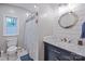 Bathroom featuring a vanity with a ship wheel mirror and shower/tub combo at 113 Hidden Ln, Mooresville, NC 28117