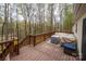Spacious wooden deck offering serene wooded views, perfect for outdoor relaxation and entertaining at 113 Hidden Ln, Mooresville, NC 28117