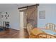 Cozy dining room featuring rustic barn door and lake-themed decor, perfect for a lake house retreat at 113 Hidden Ln, Mooresville, NC 28117