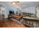 Inviting living room with a comfortable gray couch, wood floors, and soft blue walls at 113 Hidden Ln, Mooresville, NC 28117