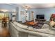 Spacious living room showcasing wood floors, comfortable seating, and a view into the kitchen at 113 Hidden Ln, Mooresville, NC 28117
