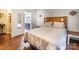 Comfortable main bedroom with wood accents and ensuite bathroom featuring a vanity with a ship wheel accent at 113 Hidden Ln, Mooresville, NC 28117