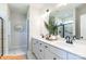 Bright bathroom featuring double vanity, quartz countertops, modern fixtures, and walk-in shower at 1234 Wendall Ln, Mount Pleasant, NC 28025
