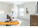 Cozy bedroom features chair and ottoman, with stylish decor, and soft natural light from the window at 1234 Wendall Ln, Mount Pleasant, NC 28025
