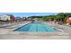 Community pool with lounge chairs and umbrellas, perfect for relaxation and recreation at 127 Wheeler Trl, Statesville, NC 28625