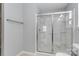 Bathroom with glass shower enclosure, neutral wall color, and a tiled floor at 12706 Ballyliffin Dr, Pineville, NC 28134