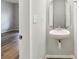 Chic half-bathroom featuring a unique sink and modern fixtures at 12706 Ballyliffin Dr, Pineville, NC 28134