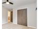 Bedroom with ceiling fan, plush carpet, closet, and access to other rooms at 12706 Ballyliffin Dr, Pineville, NC 28134