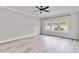 Spacious bedroom with ample natural light and hardwood floors at 12706 Ballyliffin Dr, Pineville, NC 28134