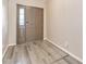 Welcoming entryway with sleek wood-look floors and a view of the front door at 12706 Ballyliffin Dr, Pineville, NC 28134
