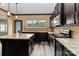 Modern kitchen with granite countertops, a central island, and stainless steel appliances at 12706 Ballyliffin Dr, Pineville, NC 28134