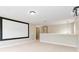 Finished theater room with projector screen and neutral carpeted floors at 12706 Ballyliffin Dr, Pineville, NC 28134