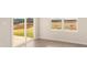Bright room with sliding glass doors leading to the outside at 129 Jacobs Hill Pl, Troutman, NC 28166