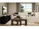 Cozy living room featuring a comfortable sectional sofa, stylish decor, and a large window for natural light at 135 Wheeler Trl, Statesville, NC 28625
