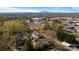 Scenic aerial shot of the property set against a mountain backdrop and lush tree coverage at 1545 7Th Avenue Sw Dr, Hickory, NC 28602