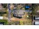 Aerial view of home with driveway, fenced backyard, and mature trees, providing a sense of privacy and outdoor space at 1545 7Th Avenue Sw Dr, Hickory, NC 28602