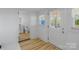 Bright hallway and bathroom with white cabinets and natural light at 1545 7Th Avenue Sw Dr, Hickory, NC 28602