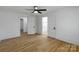 Bedroom featuring wooden floors, white walls, and two door ways at 1545 7Th Avenue Sw Dr, Hickory, NC 28602