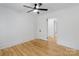 Bedroom with a closet and ceiling fan featuring wooden floors and white shiplap walls at 1545 7Th Avenue Sw Dr, Hickory, NC 28602