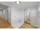 Hallway leading to bathroom, featuring wood floor at 1545 7Th Avenue Sw Dr, Hickory, NC 28602