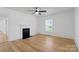 Cozy living room with hardwood floors, fireplace, and view of the front yard from the large window at 1545 7Th Avenue Sw Dr, Hickory, NC 28602