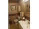 Cozy bathroom with a vanity, framed mirrors, and floral wallpaper at 160 17Th Street Nw Pl # 3E, Hickory, NC 28601