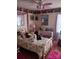 Whimsical bedroom with playful decor featuring a canopy bed and lots of doll accents at 160 17Th Street Nw Pl # 3E, Hickory, NC 28601