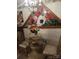 Charming dining area featuring a glass-top table, floral centerpiece, and unique wall art at 160 17Th Street Nw Pl # 3E, Hickory, NC 28601