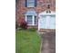 Charming brick townhouse featuring a bay window and well-manicured lawn at 160 17Th Street Nw Pl # 3E, Hickory, NC 28601