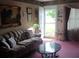 Inviting living room with patterned sofa, decorative accents, and ample natural light at 160 17Th Street Nw Pl # 3E, Hickory, NC 28601
