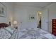 Bedroom with a floral quilt and carpeted floors at 16524 Palisades Commons Dr, Charlotte, NC 28278