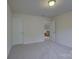 Comfortable bedroom with neutral carpet and two doors, offering space and privacy at 16524 Palisades Commons Dr, Charlotte, NC 28278