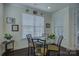 Cozy breakfast nook with dark wood floors and natural light from large window at 16524 Palisades Commons Dr, Charlotte, NC 28278