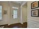 Welcoming entryway featuring hardwood floors, decorative glass door, and neutral paint creating a warm and inviting atmosphere at 16524 Palisades Commons Dr, Charlotte, NC 28278