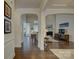 Open-concept living area with hardwood floors, arched doorways, and ample natural light for a spacious feel at 16524 Palisades Commons Dr, Charlotte, NC 28278