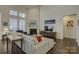 Cozy living room featuring fireplace, hardwood floors, and plenty of natural light for a relaxing ambiance at 16524 Palisades Commons Dr, Charlotte, NC 28278