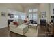 Bright living room with fireplace, hardwood floors, vaulted ceiling, and an open view to the kitchen at 16524 Palisades Commons Dr, Charlotte, NC 28278
