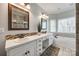 Bright bathroom features dual sinks, a soaking tub, and a decorative mosaic backsplash at 2095 Westridge Dr, Rock Hill, SC 29732