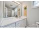 Bright bathroom featuring a large mirror, white vanity, and shower with a white curtain at 2095 Westridge Dr, Rock Hill, SC 29732