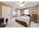 This bedroom features neutral paint, carpet flooring, and a rocking chair at 2095 Westridge Dr, Rock Hill, SC 29732