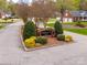 Westridge Farm entrance featuring a brick sign surrounded by manicured greenery and mature trees at 2095 Westridge Dr, Rock Hill, SC 29732