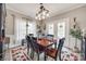 Bright dining area with a wooden table, stylish chairs, and ample natural light, creating a welcoming atmosphere for meals at 2095 Westridge Dr, Rock Hill, SC 29732
