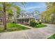 Beautiful two-story home with a sprawling porch, showcasing curb appeal and a tranquil setting surrounded by lush greenery at 2095 Westridge Dr, Rock Hill, SC 29732