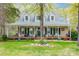Charming home boasts a welcoming front porch with rocking chairs and beautifully landscaped yard at 2095 Westridge Dr, Rock Hill, SC 29732