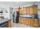 Bright kitchen showcasing oak cabinets and stainless steel refrigerator at 2095 Westridge Dr, Rock Hill, SC 29732