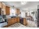Well-lit kitchen showcasing oak cabinets, modern appliances, and eat-in dining area at 2095 Westridge Dr, Rock Hill, SC 29732