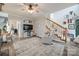 Cozy living room with a modern TV setup, comfortable seating, and a view of the staircase, offering a relaxing space at 2095 Westridge Dr, Rock Hill, SC 29732
