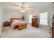 Spacious main bedroom with a ceiling fan, a large bed, and ample natural light at 2095 Westridge Dr, Rock Hill, SC 29732