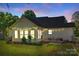 Cozy backyard features a patio, grill, string lights, and well-maintained lawn perfect for outdoor entertaining and relaxation at 2175 Highwood Rd, Rock Hill, SC 29732